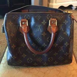 Luis Vuitton “little speedy” small handbag.